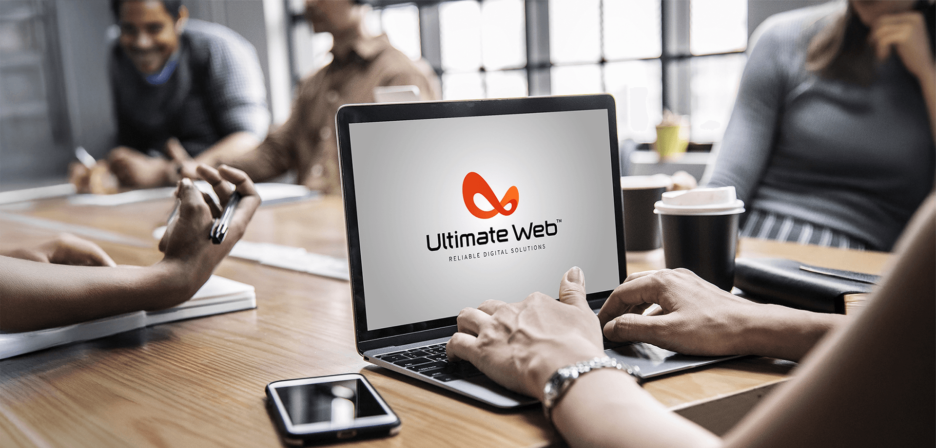 Professional business meeting with Ultimate Web laptop